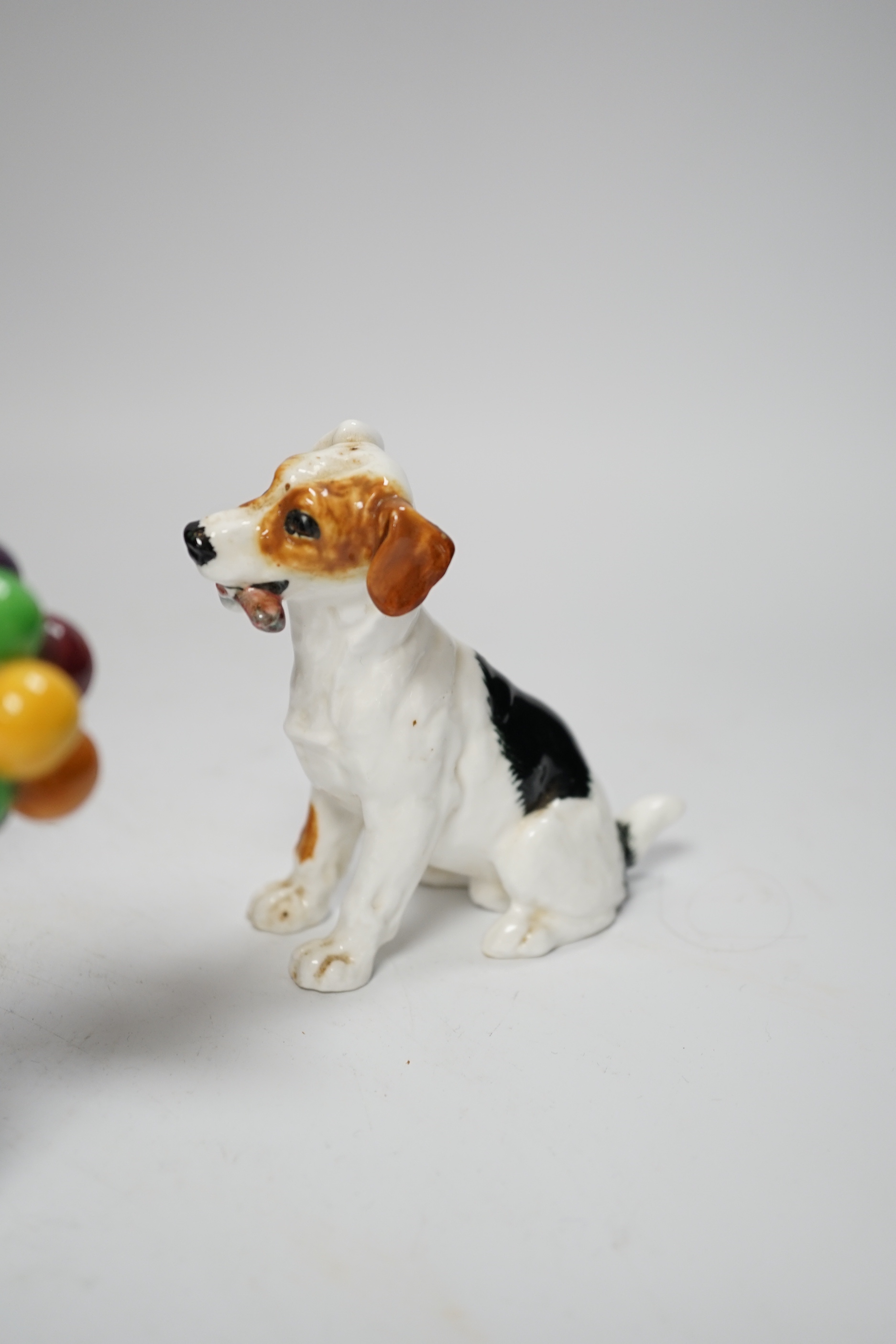 A Burmantofts style grotesque toad spoon warmer, a Royal Doulton dog ornament and The Balloon Seller, toad 18cm long